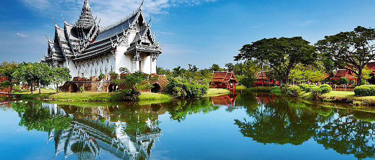 The Sanphet Prasat Palace with reflections along the water in the Ancient City of Bangkok, Thailand