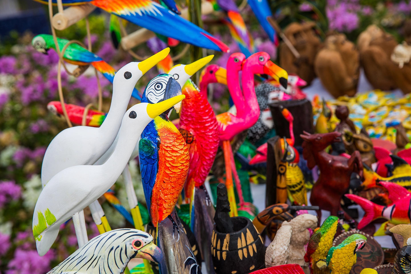 Colorful St. Kitts souvenirs, including crafts and trinkets, arranged together in a vibrant market display. - St. Kitts