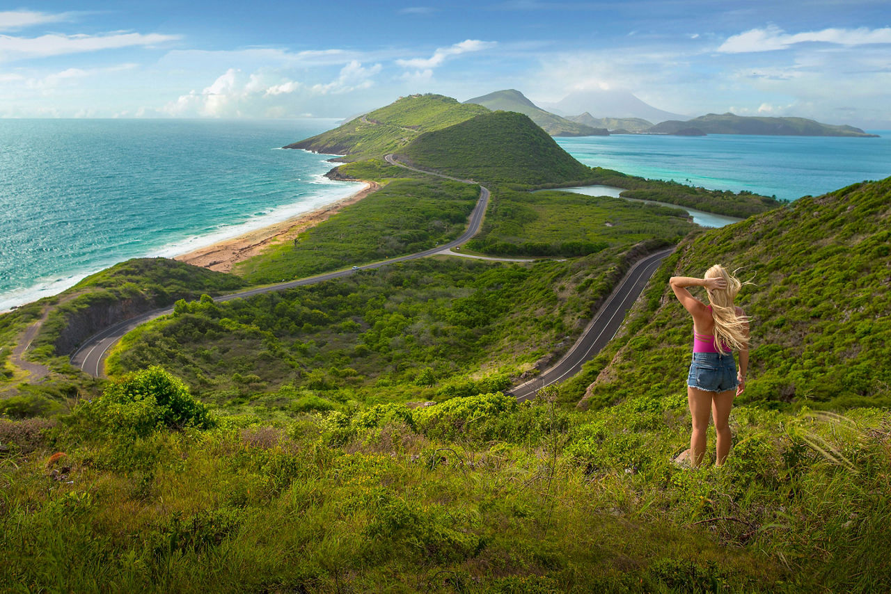 Girl Hiking Staring at the Coast. St. Kitts Nevis 
