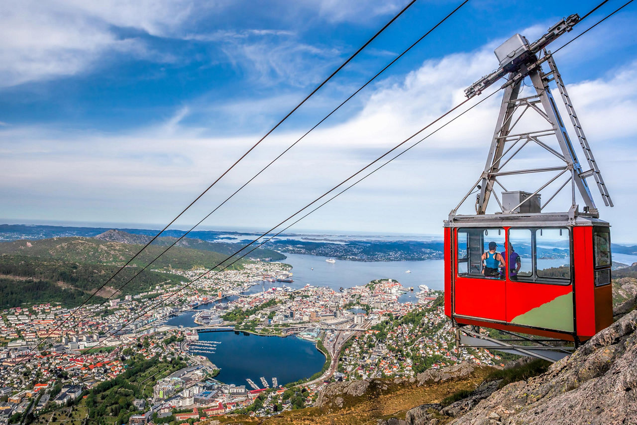 A cable car going up a mountain over Bergen, Norway