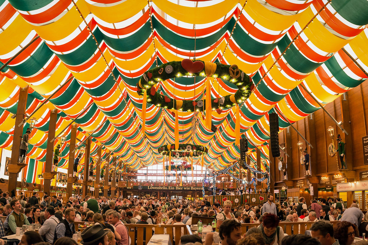 People drinking in the Hippodrom Beer Tent on the Theresienwiese Oktoberfest fair grounds Germany