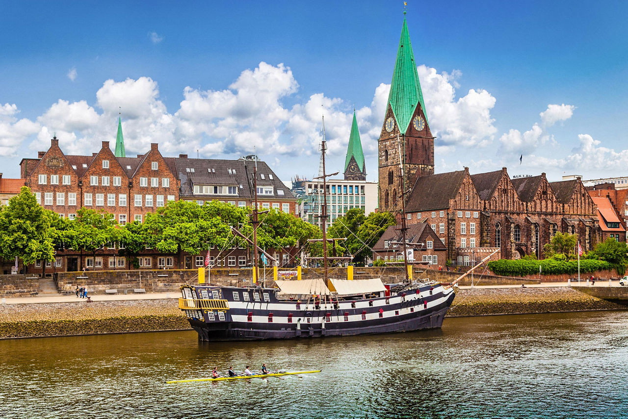 Historic town of Bremen with an old sailing ship on Weser river near Bremerhaven, Germany
