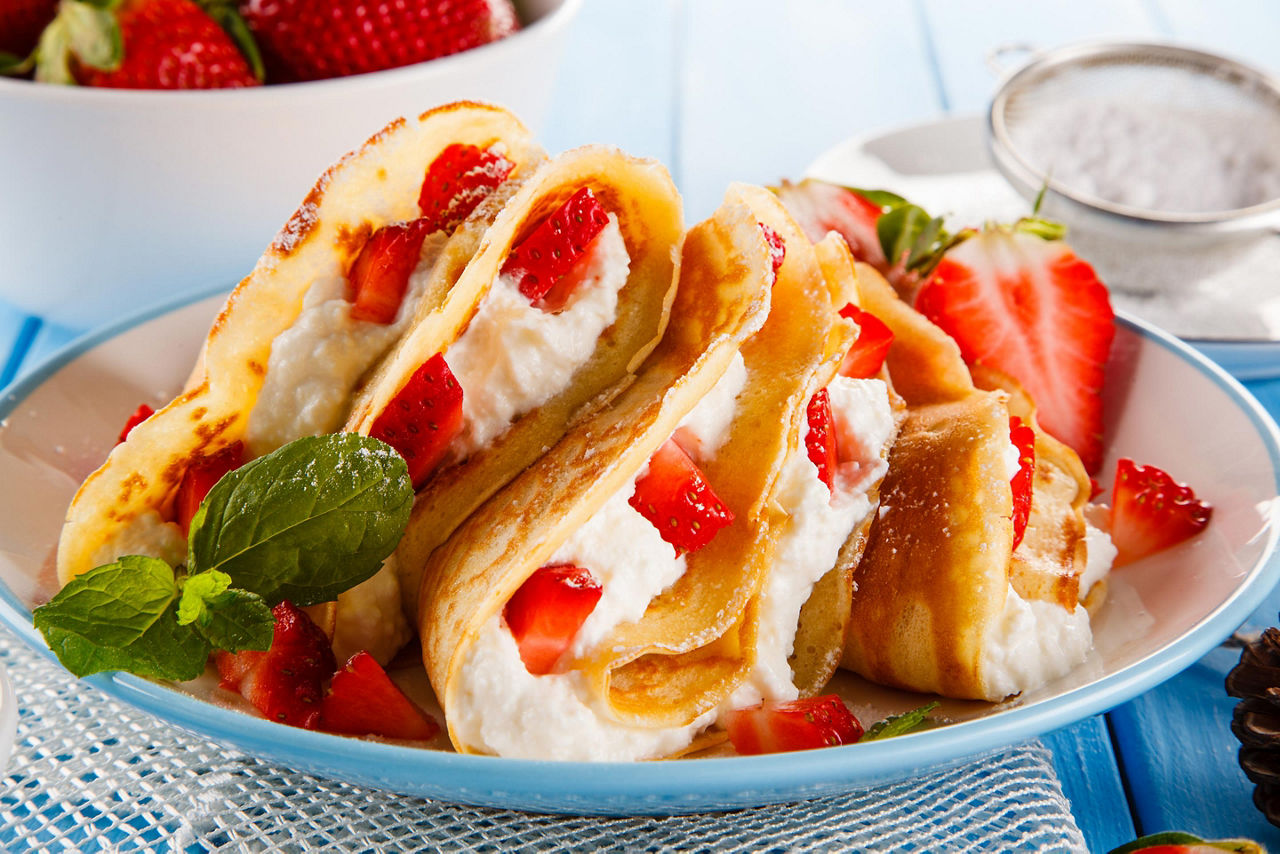 A crepe filled with strawberries and cream