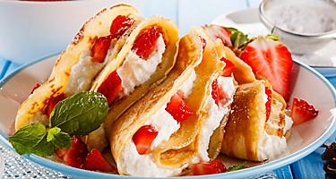 A crepe filled with strawberries and cream