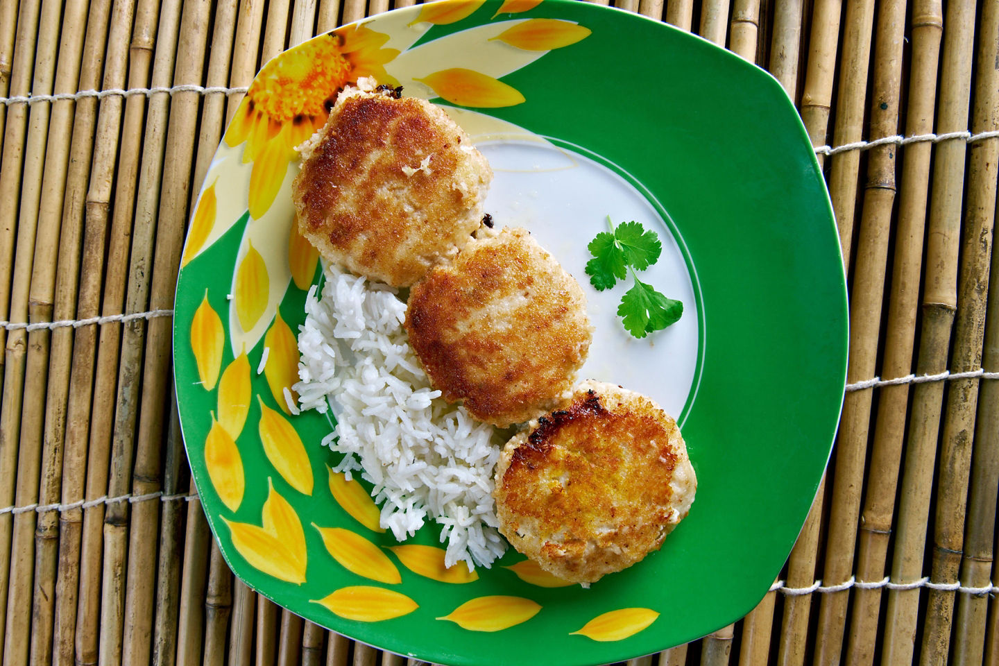 Golden Bajan fish cakes sit on a plate, showing their crisp exterior and fluffy texture. - Bridgetown, Barbados