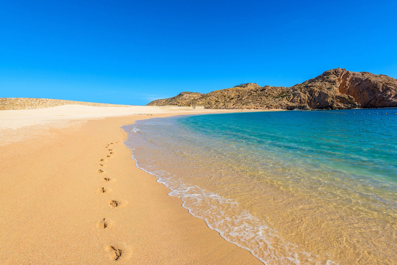 Footsteps in the sand at Santa Maria Beach in Cabo San Lucas. Mexico.