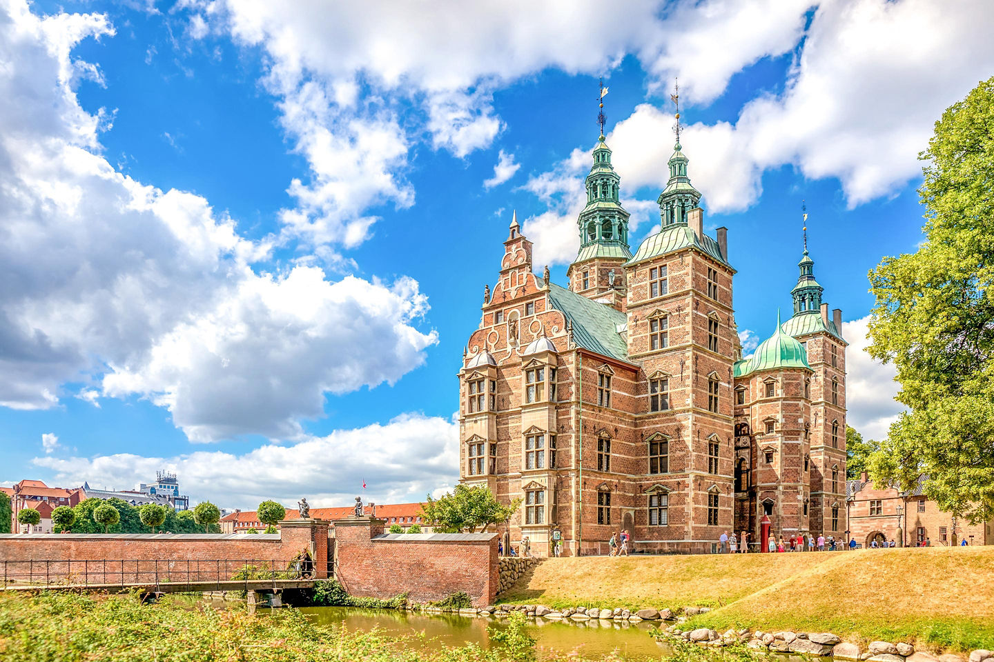 Rosenborg Castle rises above its gardens, framed by trees and soft Copenhagen daylight. - Copenhagen, Denmark