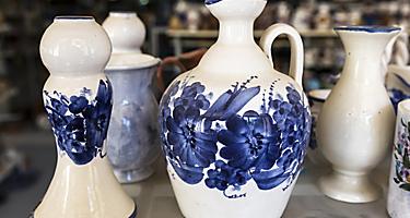 Traditional Greek ceramic pottery with blue floral decorations, on a shop in Corfu, Greece
