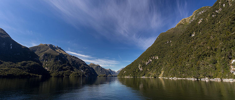 Between two mountains in the ocean in Doubtful Sound New Zealand