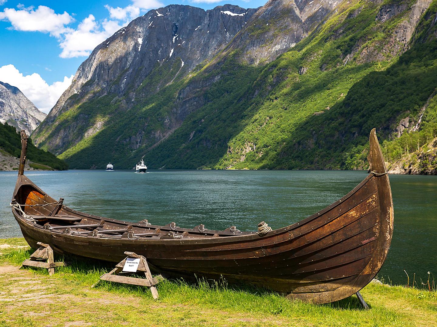 A Replica Viking Boat with Mountains in the Background, Flam, Norway 