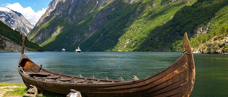 A Replica Viking Boat with Mountains in the Background, Flam, Norway 