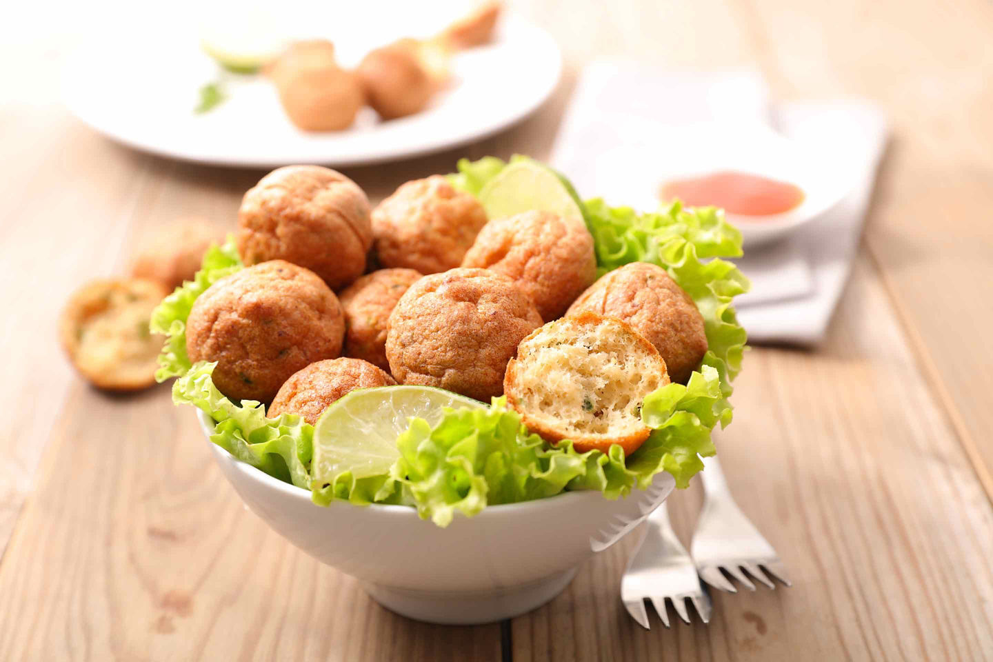Golden accras de morue show their crisp exterior and fluffy salted‑cod filling. - Fort-de-France, Martinique