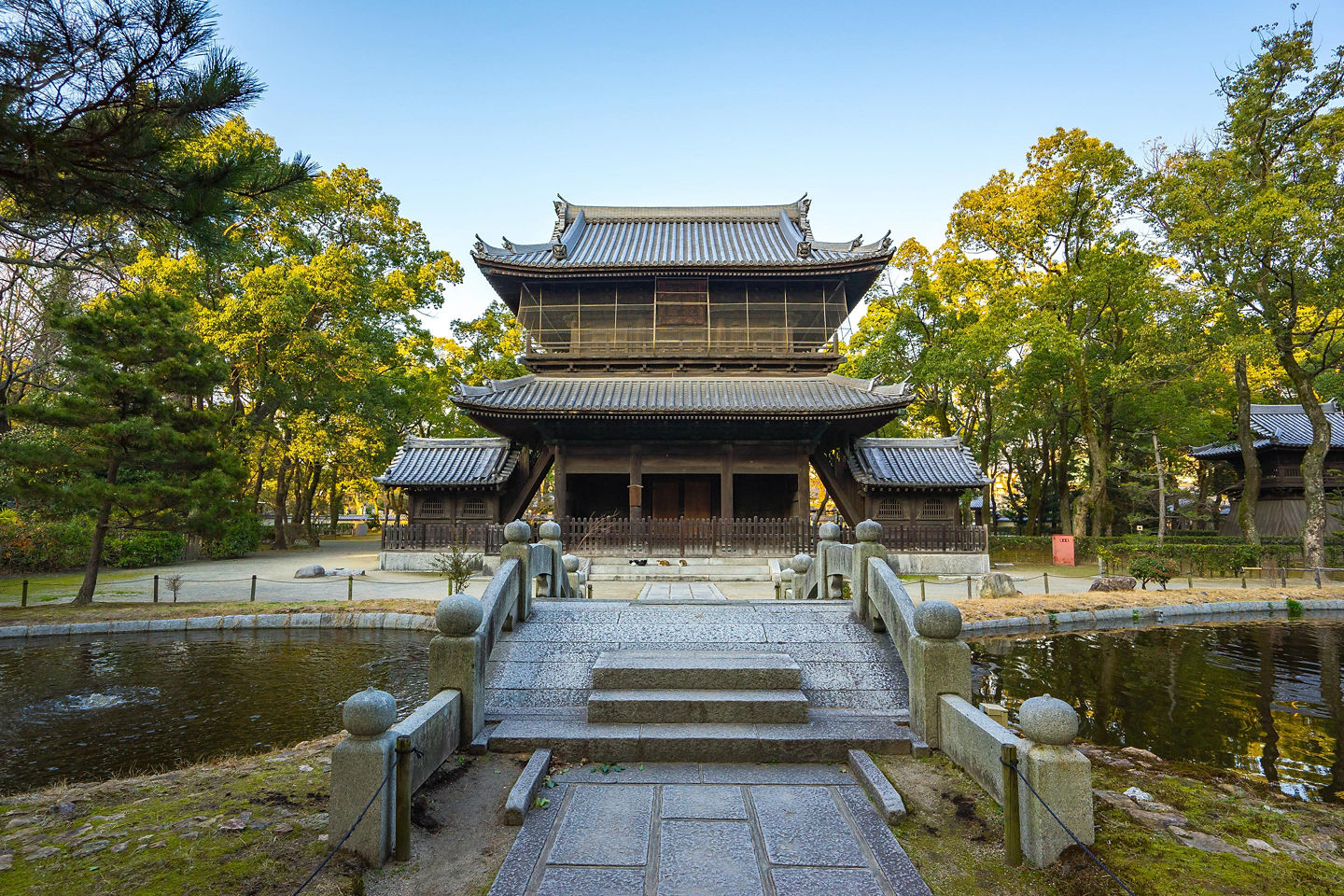 Entrance of Shofukuji Zen Temple surrounded by trees. - Fukuoka, Japan