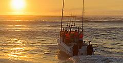Fishing boat at sunrise with fishing rods and outriggers. Galveston.