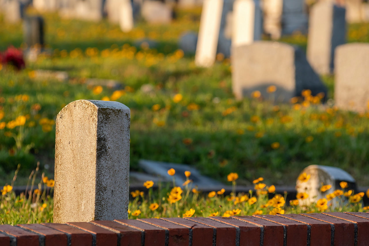 Headstone in a cemetery on Galveston, Texas island beach vibes in spring summer