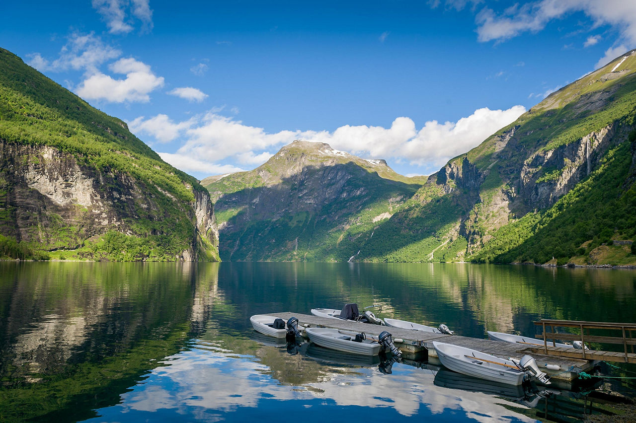 Geiranger, Norway, Small Boats Docked At Pier