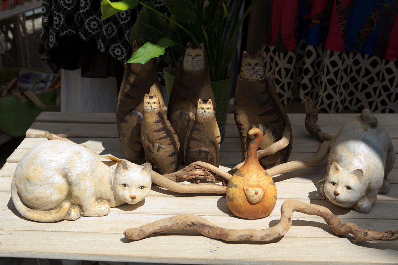 An assortment of souvenir cat statues
