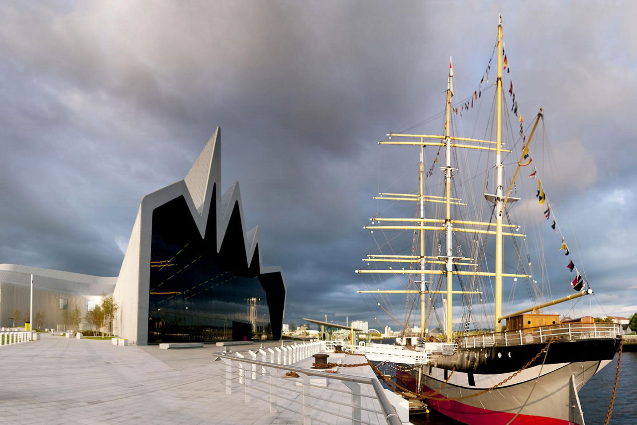 A vintage ship docked next to the Riverside Museum in Glasgow, Scotland