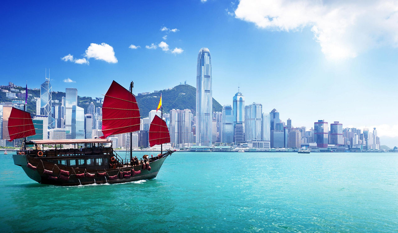 A boat sailing through Hong Kong harbor