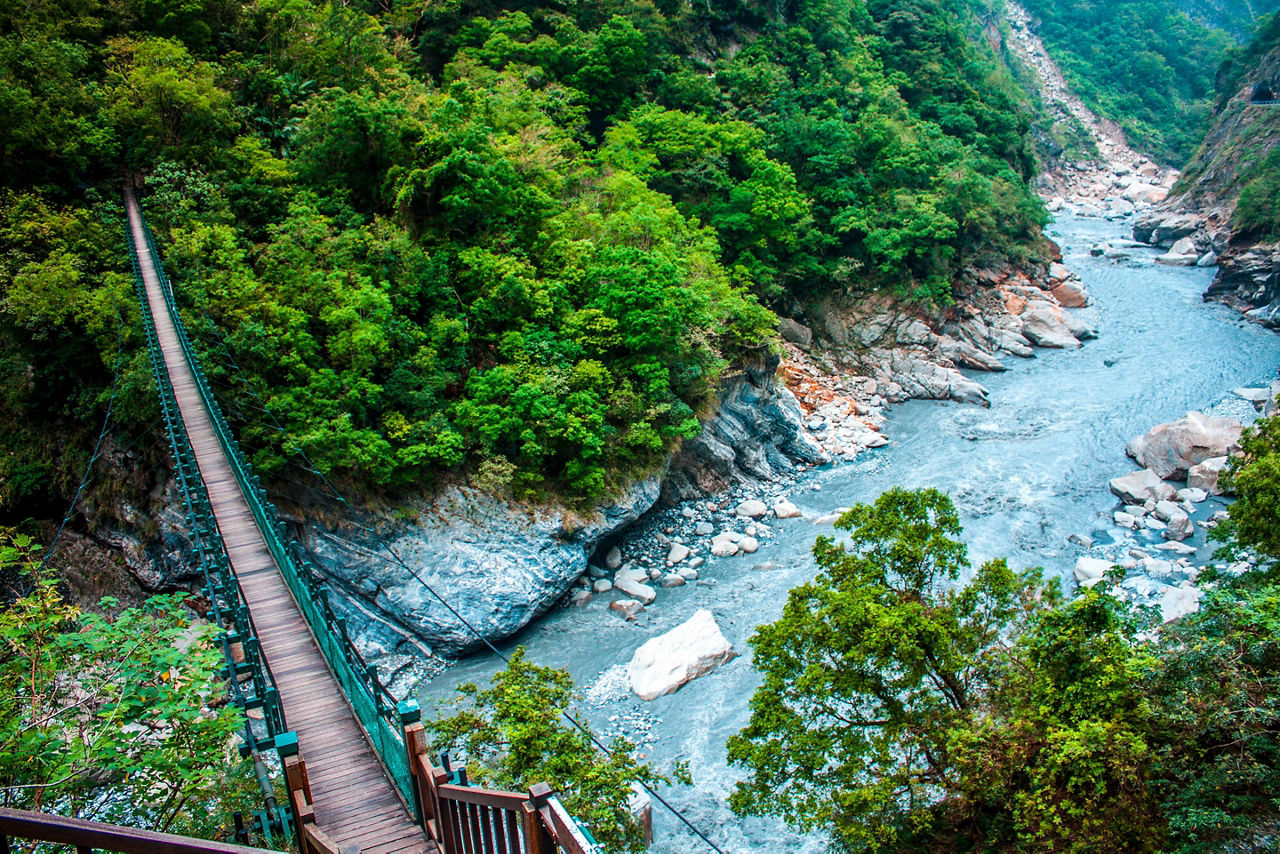 A wooden bridge to help people cross over a stream in Taroko Gorge National Park in Hualien, Taiwan