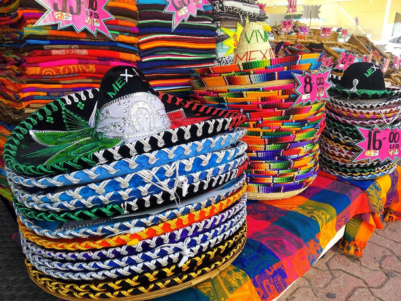 Piles of traditional colorful Mexican hats sold in souvenir shops