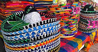 Piles of traditional colorful Mexican hats sold in souvenir shops