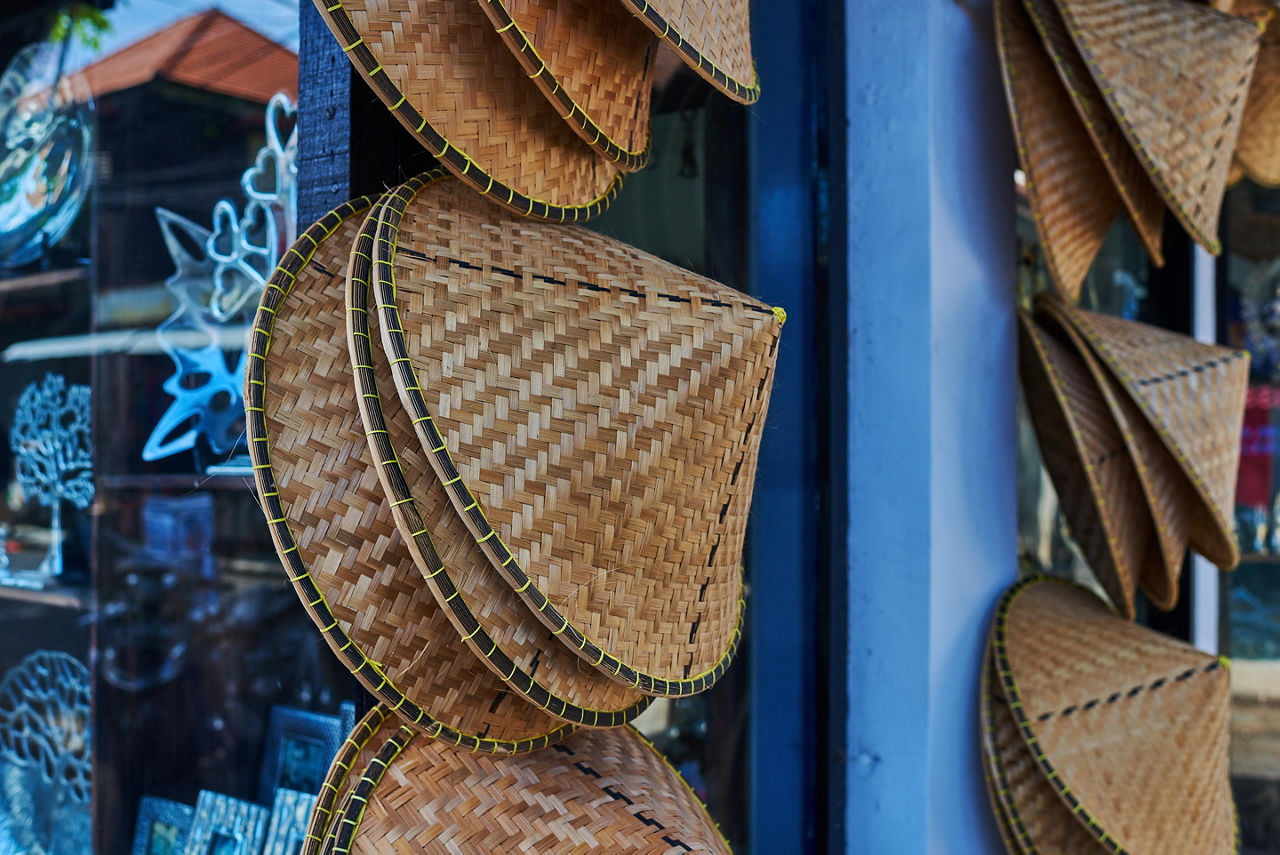 Traditional bamboo hats are common souvenirs while shopping in Vietnam