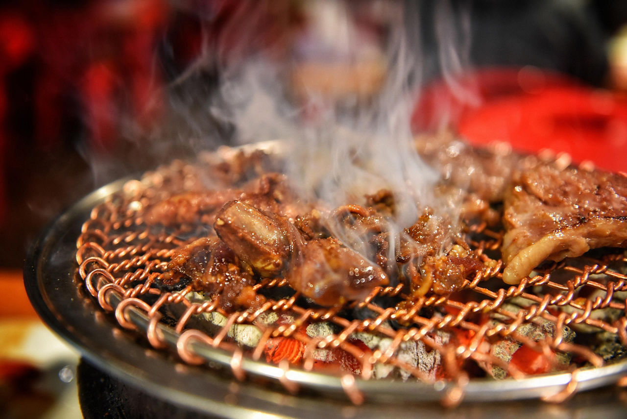 Korean barbecue with pork on the grill