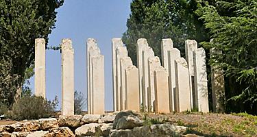 The Holocaust Sculpture with broken columns coming out of the ground in Jerusalem, Israel