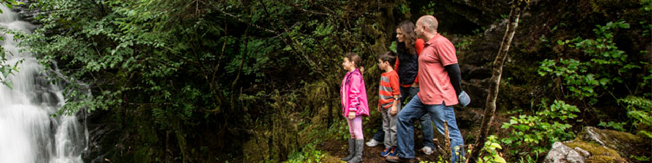 Family viewing waterfall