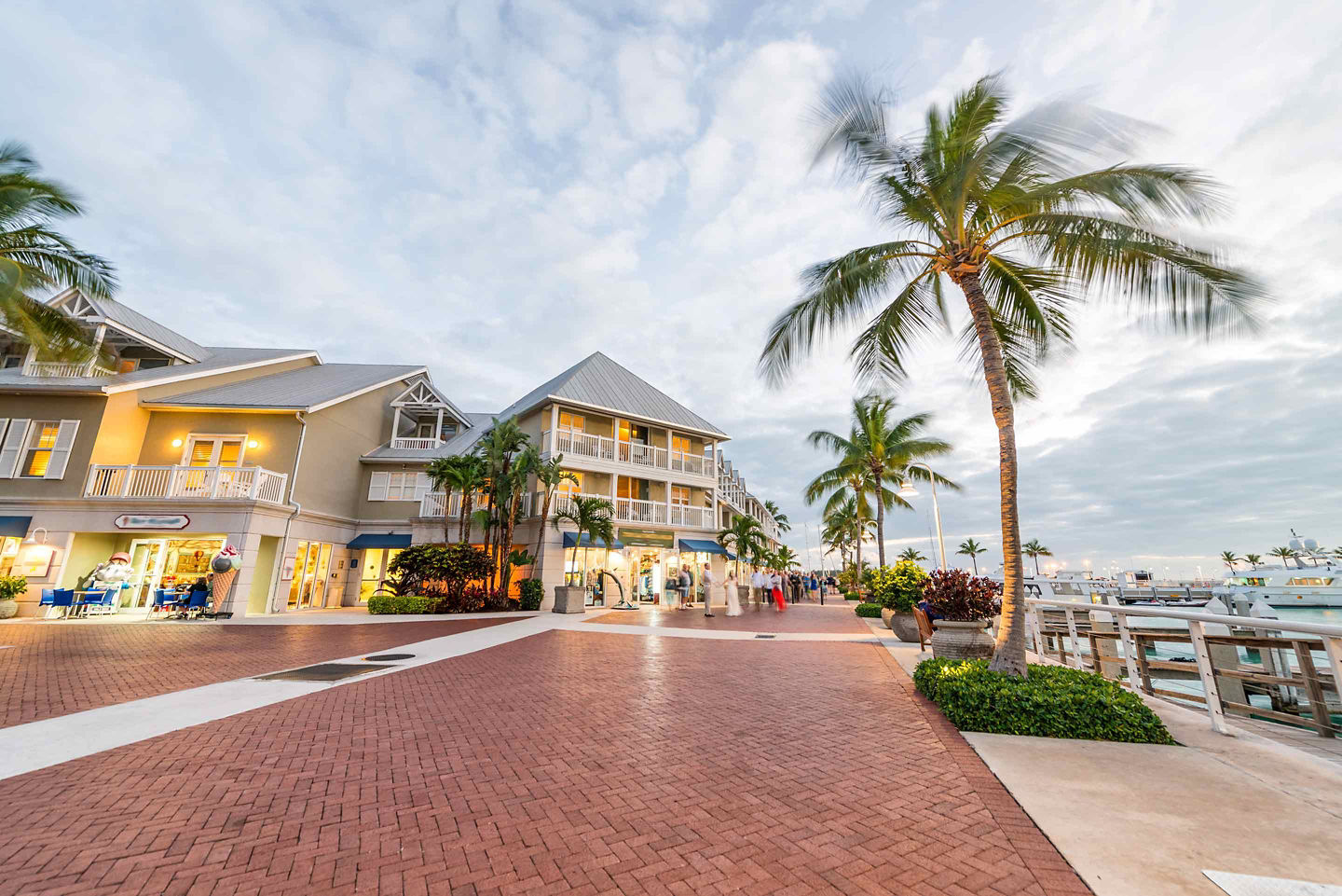 Colorful Key West shops line a lively pedestrian street. - Key West, Florida