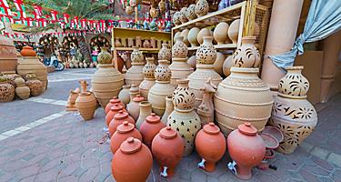 Clay jugs for sale at a market in Oman