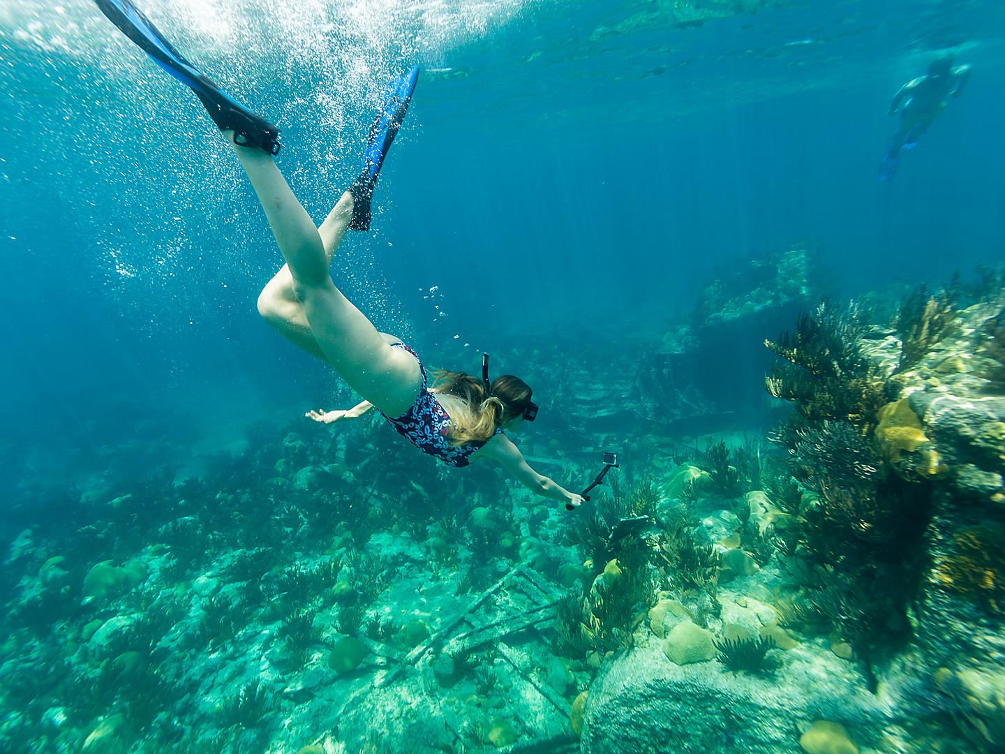 Woman Snorkeling by a Coral, Bermuda