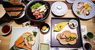 Kaiseki and traditional Japenese cuisine layed out on a table