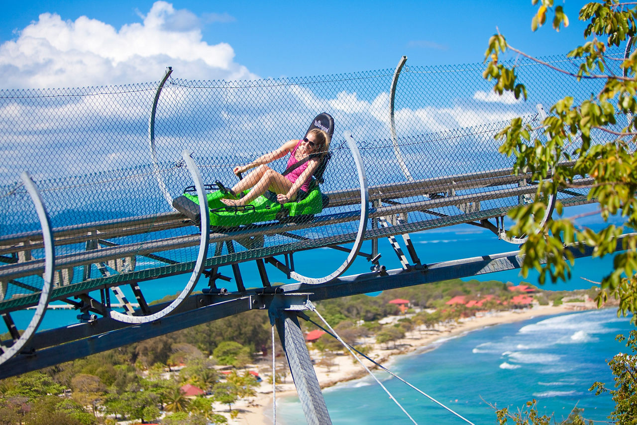 Girl Riding Dragon's Tail Coaster with View of the Beach, Labadee, Haiti