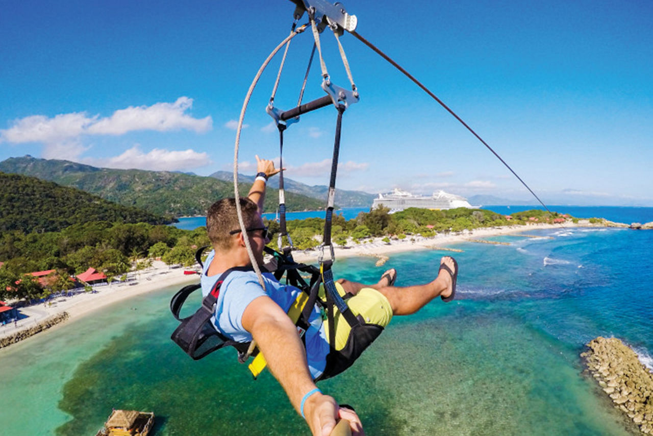 Man Enjoying the Zip line in Labadee, Haiti
