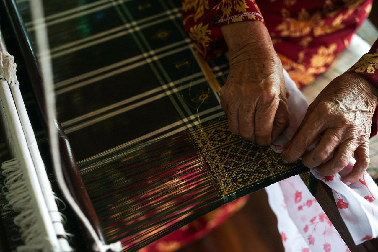 Songket is a fabric that belongs to the brocade family of textiles of Indonesia, Malaysia and Brunei. It is hand-woven in silk or cotton, and intricately patterned with gold or silver threads.