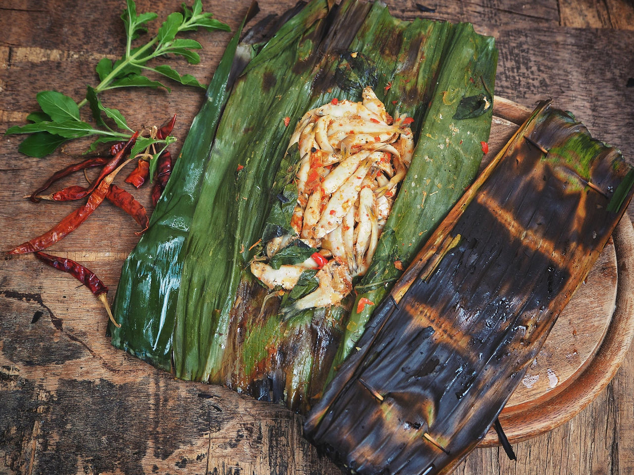 Grilled fish in a banana leaf