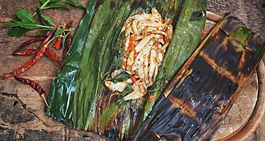 Grilled fish in a banana leaf