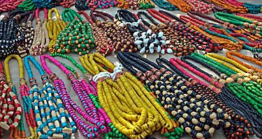 An assortment of colorful necklaces for sale