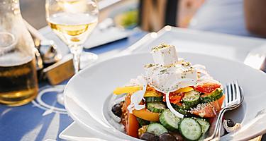 Greek salad with fresh cucumbers, tomatoes, basil and olives, in Limassol, Cyprus