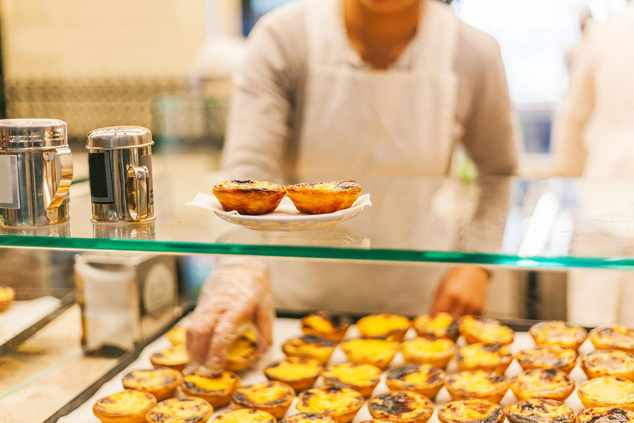 A tray full of Pasteis de Nata pastries in Lisbon, Portugal