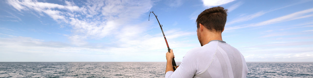 Man fishing in an open sea, ocean.