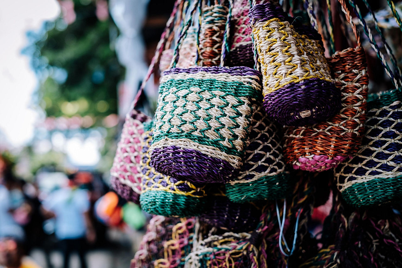 A bunch of colorful handmade purse made out of Manila hemp sold on the streets in the Philippines