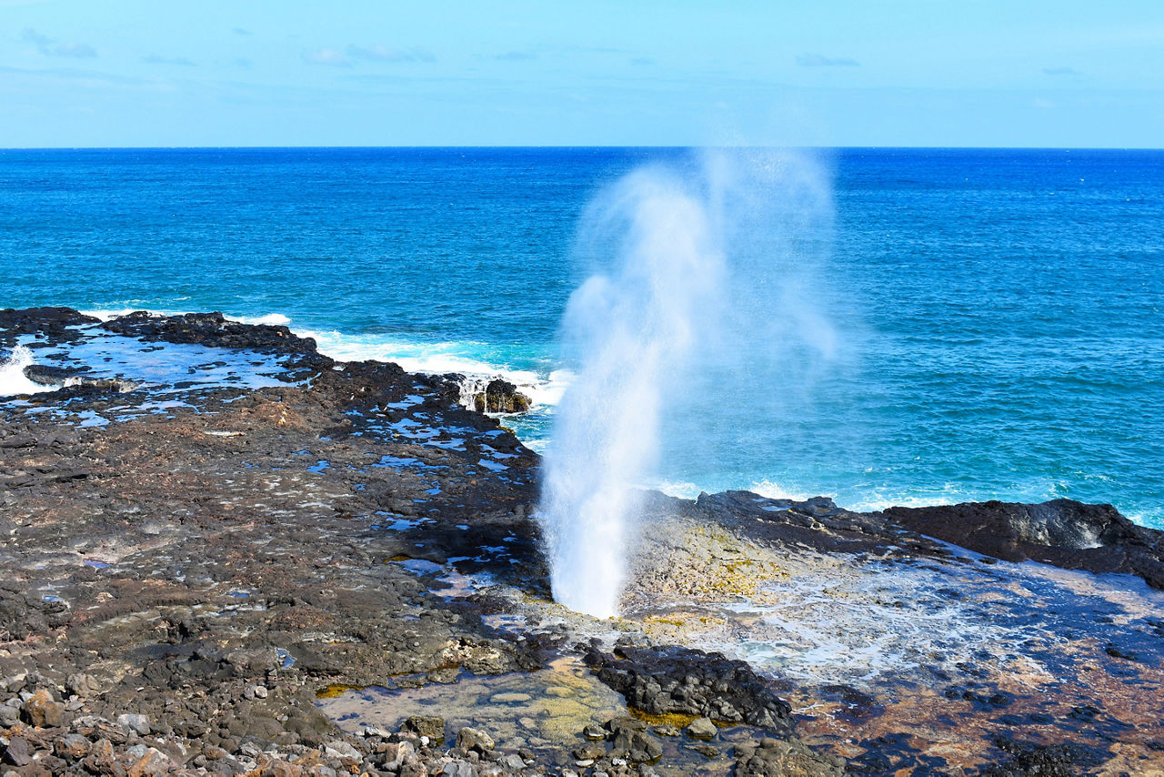 Hawaiian blow hole on Maui with a gorgeous blue ocean in the background