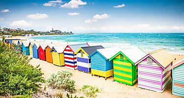 Colorful bathing houses on white sandy beach at Brighton beach in Melbourne