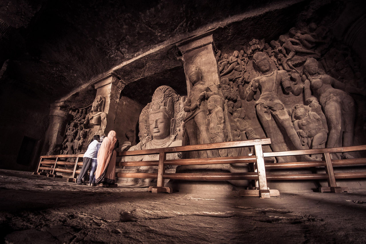 Statues inside the Elephanta Caves in Mumbai, India