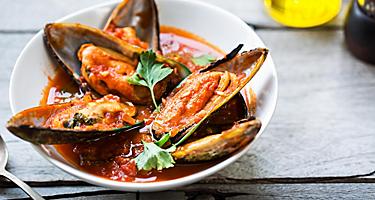 Mussels in tomato and herb sauce in New Zealand