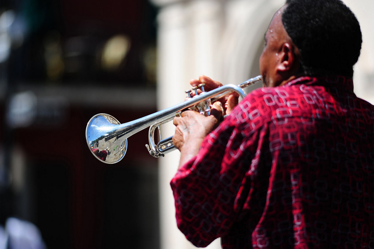 Musician playing trumpet in the streets