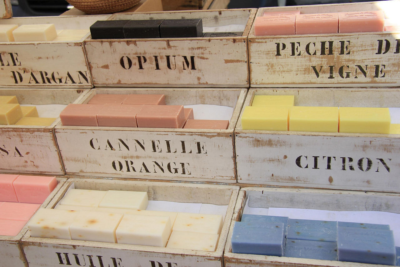 An assortment of scented soaps in wooden crates for sale in France